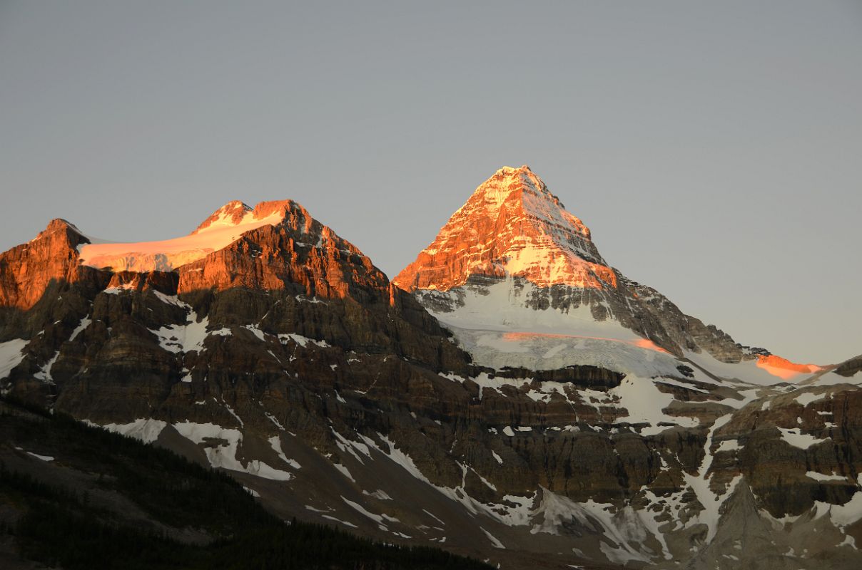 24 Bright Orange Light Of Sunrise On Mount Magog and Mount Assiniboine And Glacier Below Summit From Lake Magog